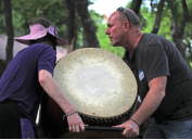 It's not all limelight.  Jen and Bryan moving equipment at MANY Faces ONE Peace ALL My Relations Festival at Kiest Park, May, 2013